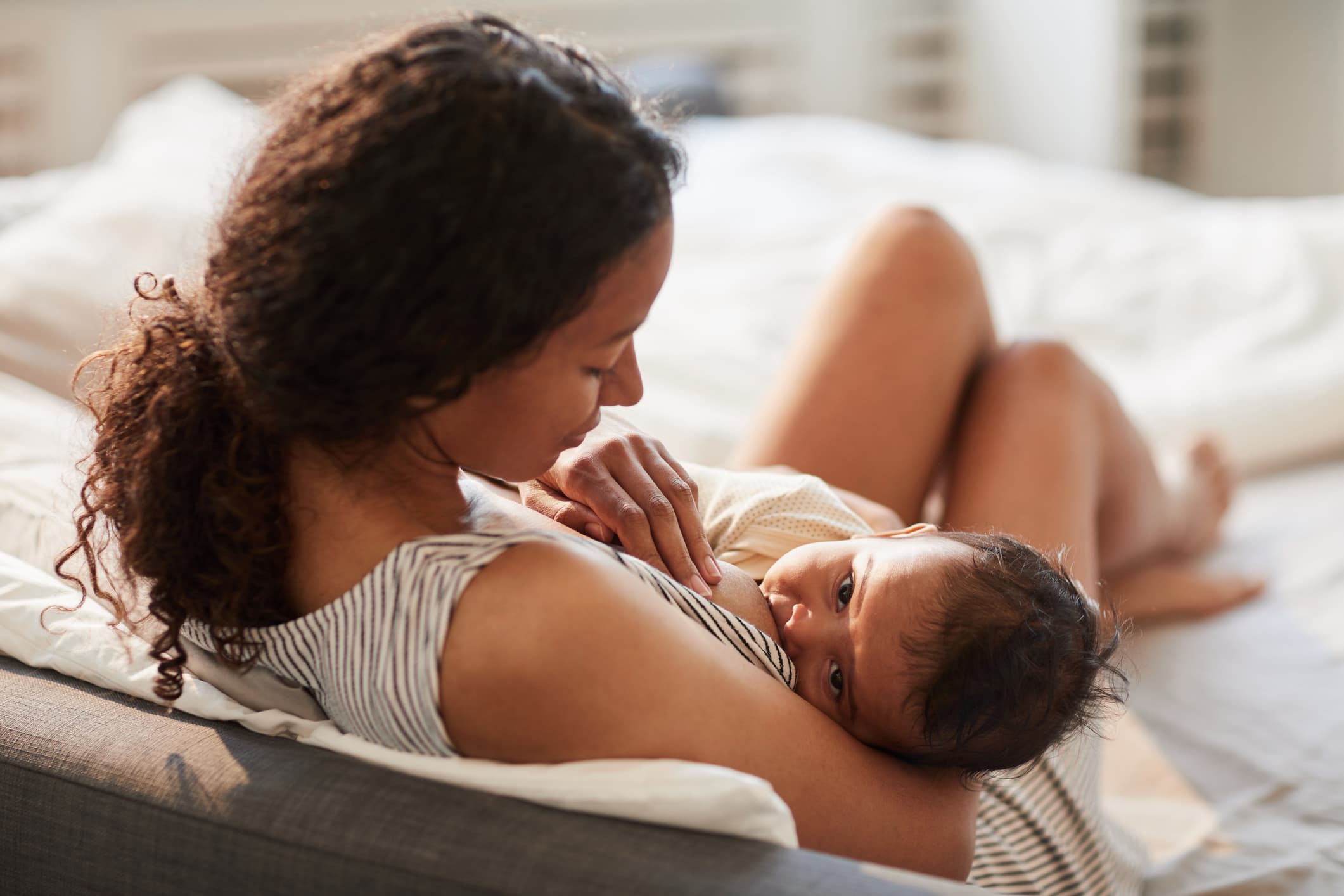 A mother breastfeeding her newborn